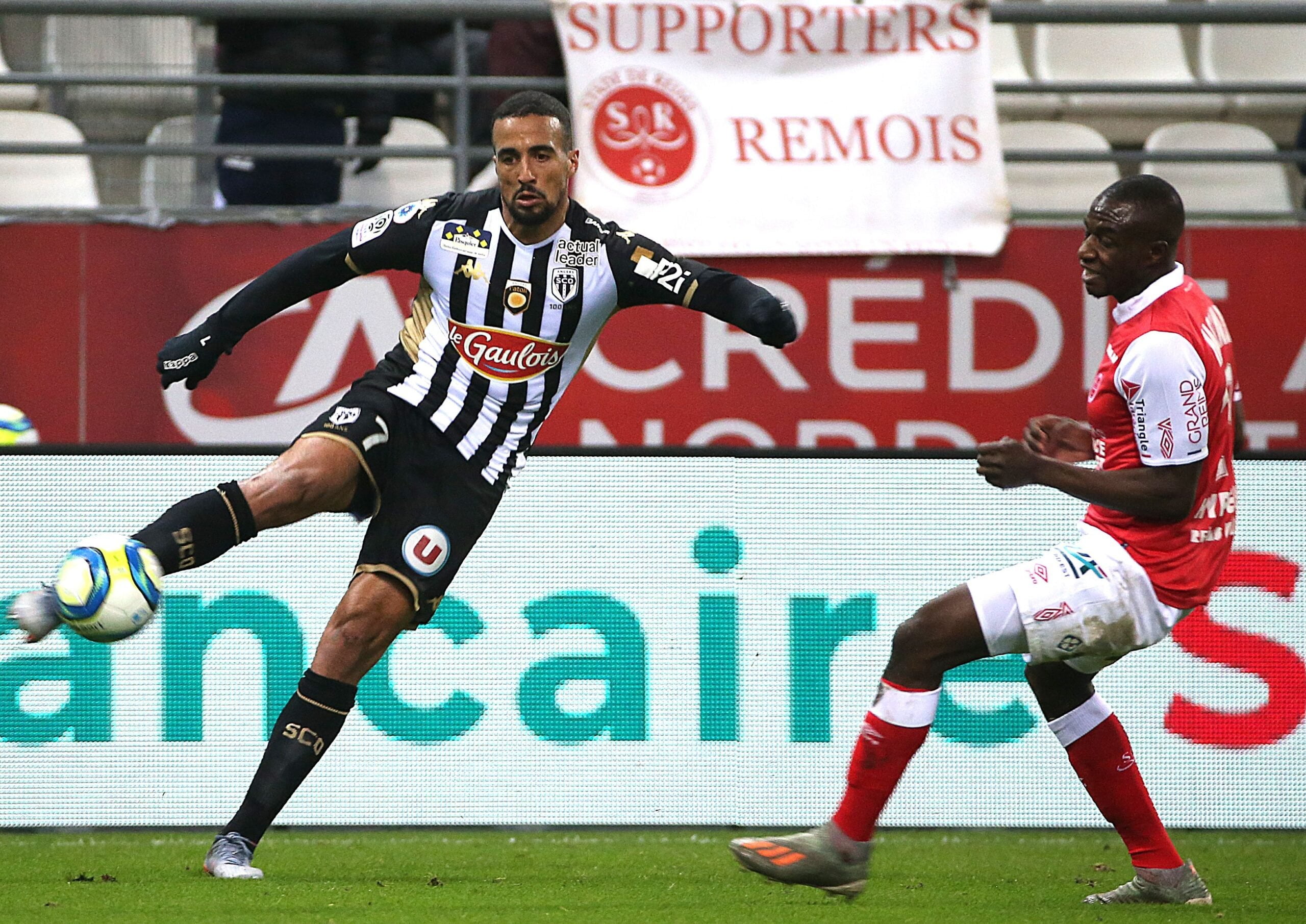 Reims' French midfielder Hassane Kamara (R) vies with Angers' Moroccan forward Rachid Alioui (L) during the French L1 football match Reims vs Angers on November 9, 2019 at the Auguste Delaune Stadium in Reims. (Photo by FRANCOIS NASCIMBENI / AFP) (Photo by FRANCOIS NASCIMBENI/AFP via Getty Images)