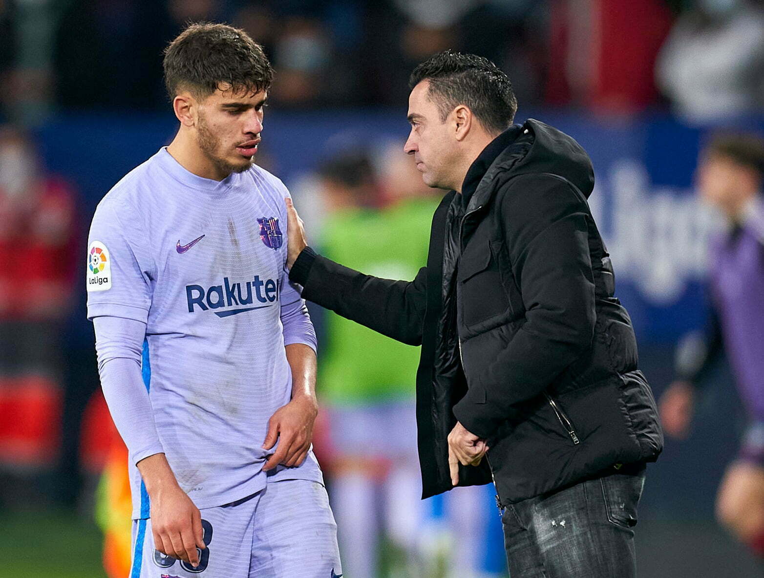 PAMPLONA, SPAIN - DECEMBER 12: Xavi Hernandez, Manager of FC Barcelona gives instructions to Abdessamad Ezzalzouli during the La Liga Santander match between CA Osasuna and FC Barcelona at Estadio El Sadar on December 12, 2021 in Pamplona, Spain. (Photo by Quality Sport Images/Getty Images)