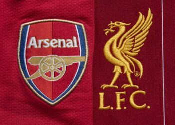 MANCHESTER, ENGLAND - MAY 04: The Liverpool and Arsenal club crests on their first team home shirts on May 4, 2020 in Manchester, England (Photo by Visionhaus)