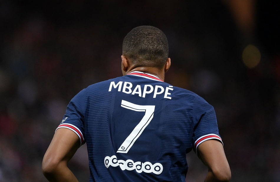 Paris Saint-Germain's French forward Kylian Mbappe runs on the pitch during the French L1 football match between Stade de Reims and Paris Saint-Germain (PSG) at Stade Auguste Delaune in Reims, northern France on August 29, 2021. (Photo by FRANCK FIFE / AFP)