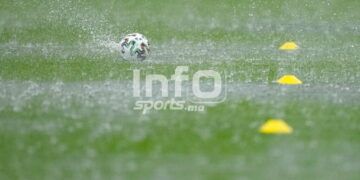 A ball falls on the wet pitch during a heavy rainfall before Austria's training session at the National Arena stadium in Bucharest, Romania, Saturday, June 12, 2021, the day before their first match against North Macedonia. (AP Photo/Vadim Ghirda)