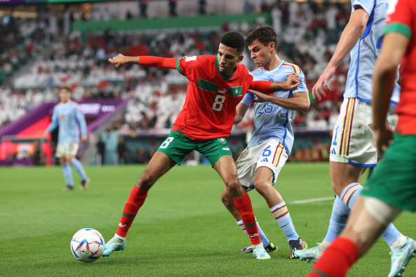 AL RAYYAN, QATAR - DECEMBER 06: Azzedine Ounahi of Morocco shields the ball from Pedri of Spain during the FIFA World Cup Qatar 2022 Round of 16 match between Morocco and Spain at Education City Stadium on December 6, 2022 in Al Rayyan, Qatar. (Photo by Charlotte Wilson/Offside/Offside via Getty Images)