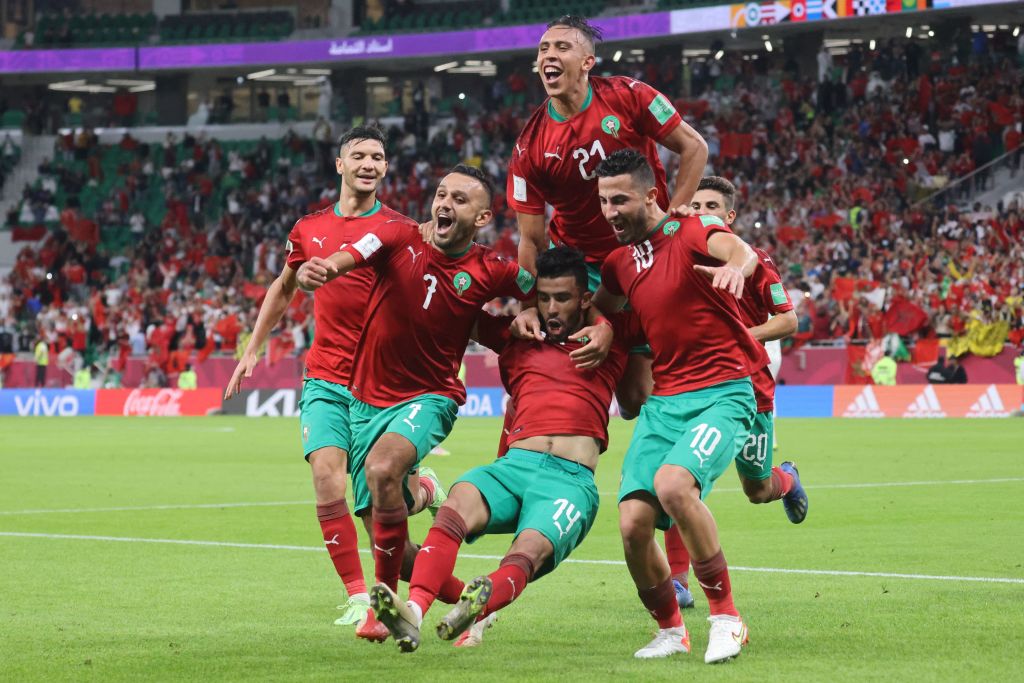 Morocco's forward Karim el-Berkaoui (C) celebrates with teammates afater scoring the opening goal during the FIFA Arab Cup 2021 group C football match between Morocco and Saudi Arabia at the Al-Thumama Stadium in the capital city of Doha on December 7, 2021. (Photo by KARIM SAHIB / AFP) (Photo by KARIM SAHIB/AFP via Getty Images)