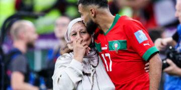 Sofiane Boufal (R) of Morocco celebrates with a family member after winning the Quarterfinal between Morocco and Portugal of the 2022 FIFA World Cup at Al Thumama Stadium in Doha, Qatar, December 10, 2022. (Photo by Cao Can/Xinhua/ABACAPRESS.COM - Photo by Icon sport