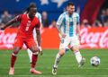 Jun 20, 2024; Atlanta, GA, USA; Argentina forward Lionel Messi (10) plays the ball in front of Canada midfielder Ismael Kone (8) during the first half at Mercedez-Benz Stadium. Mandatory Credit: Dale Zanine-USA TODAY Sports/Sipa USA