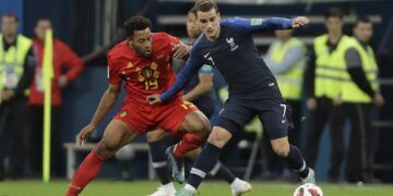 France's Antoine Griezmann, shields the ball from Belgium's Moussa Dembele during the semifinal match between France and Belgium at the 2018 soccer World Cup in the St. Petersburg Stadium in, St. Petersburg, Russia, Tuesday, July 10, 2018. (AP Photo/Natacha Pisarenko)