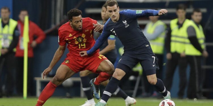 France's Antoine Griezmann, shields the ball from Belgium's Moussa Dembele during the semifinal match between France and Belgium at the 2018 soccer World Cup in the St. Petersburg Stadium in, St. Petersburg, Russia, Tuesday, July 10, 2018. (AP Photo/Natacha Pisarenko)